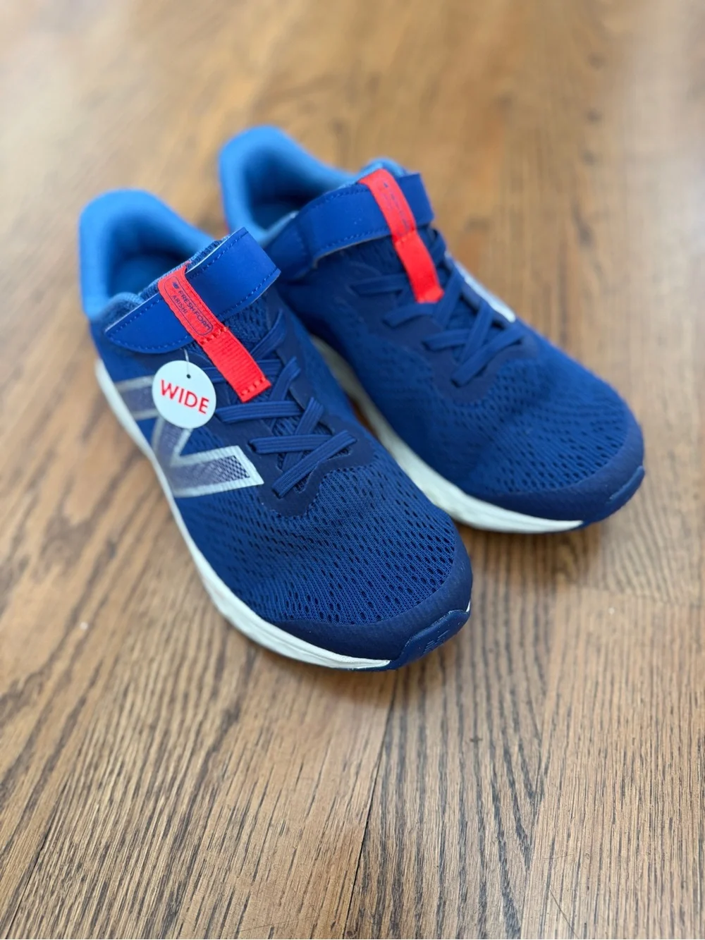 Brand new with tags, without New Balance Kids' Wide Fit Navy & Red Running Shoes